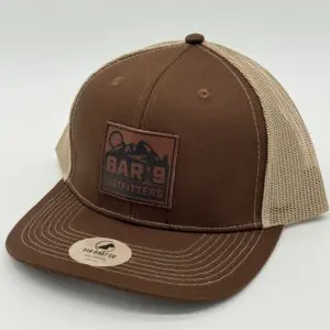 Brown and beige cap with logo patch.
