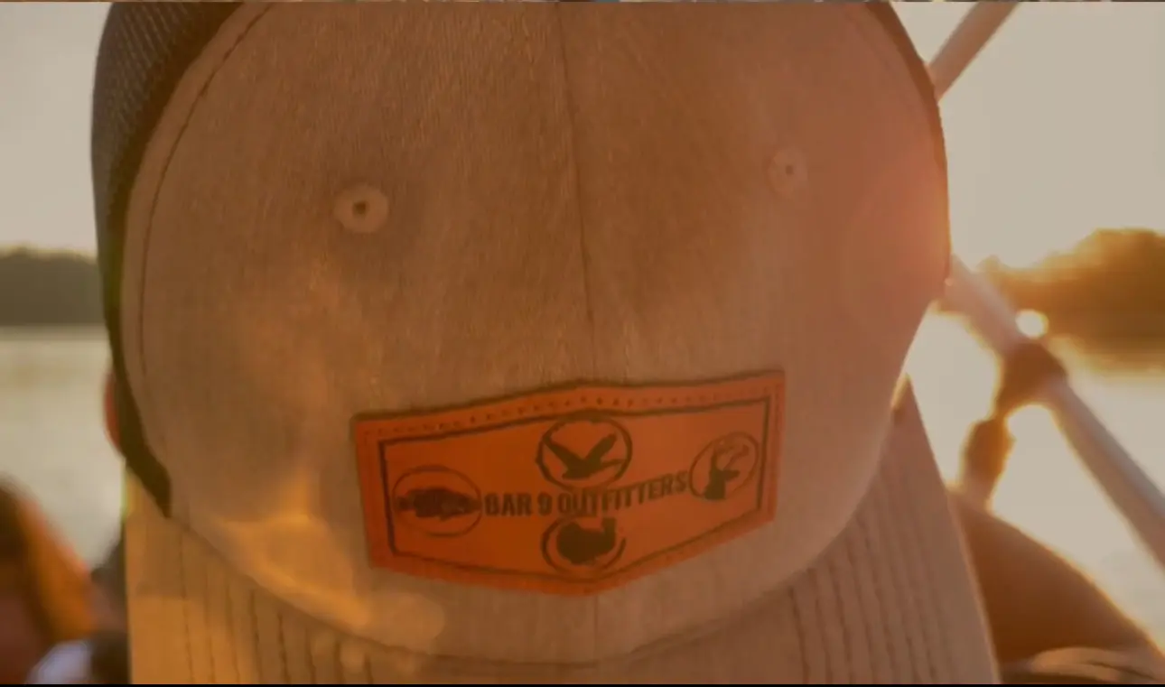 Baseball cap with outdoor brand logo.